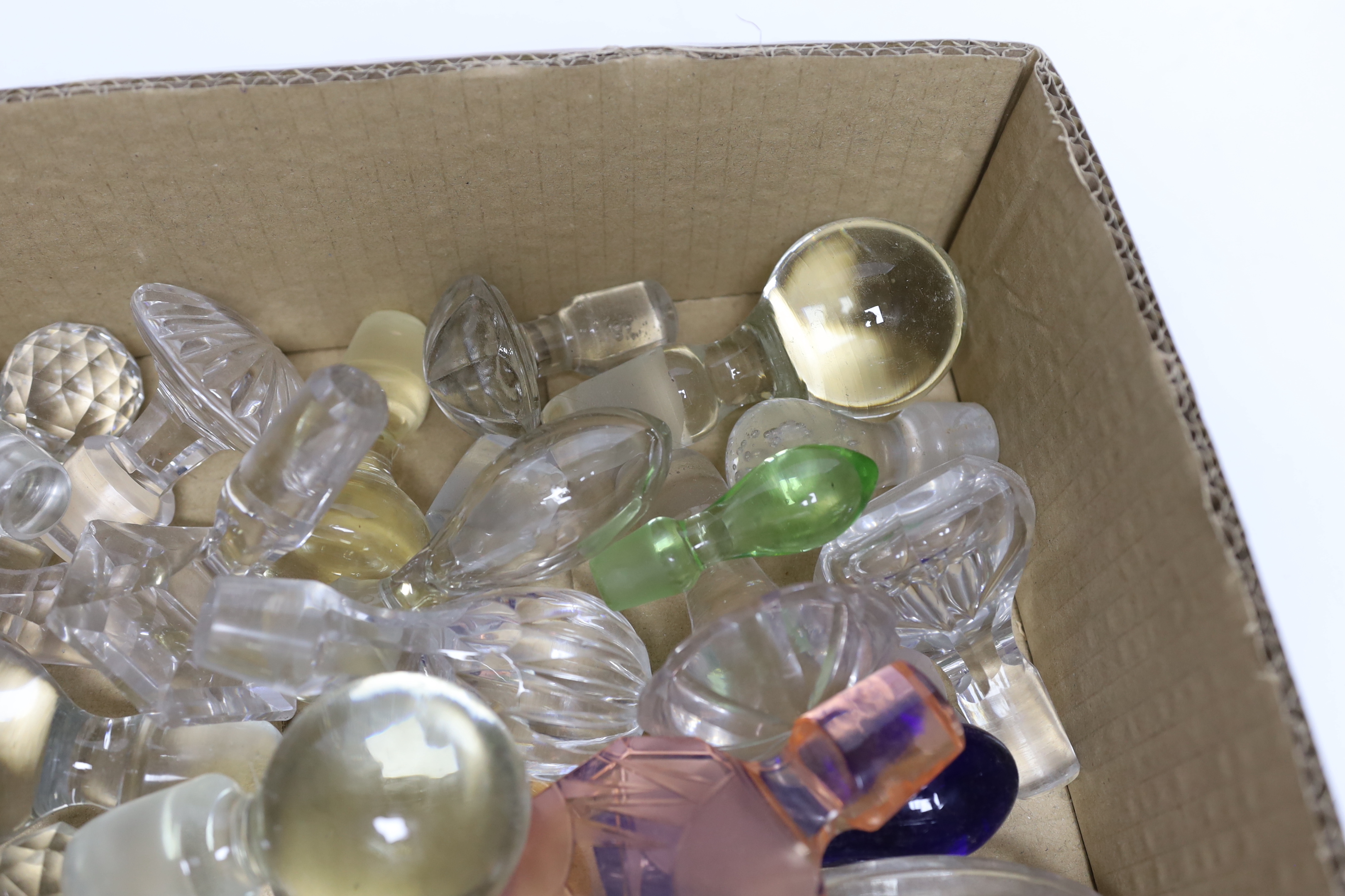 A collection of decanter and scent bottle stoppers